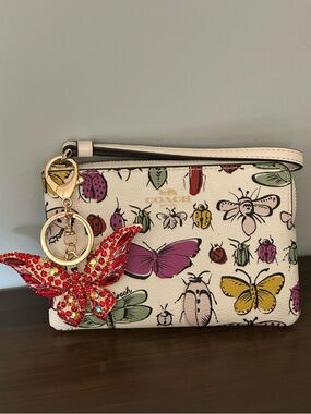 Coach corner Zip Wristlet Wallet With Creature Print And Butterfly Charm